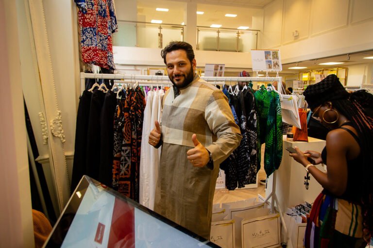 A guest giving a thumbs up in a resident brand outfit