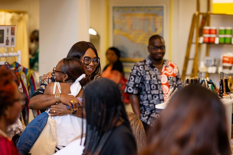 Two guests hugging at TALES House